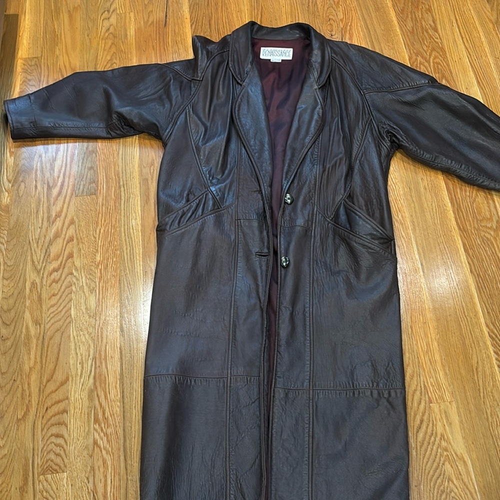 Long brown leather coat. Soft buttery leather. Very stylish. No flaws.